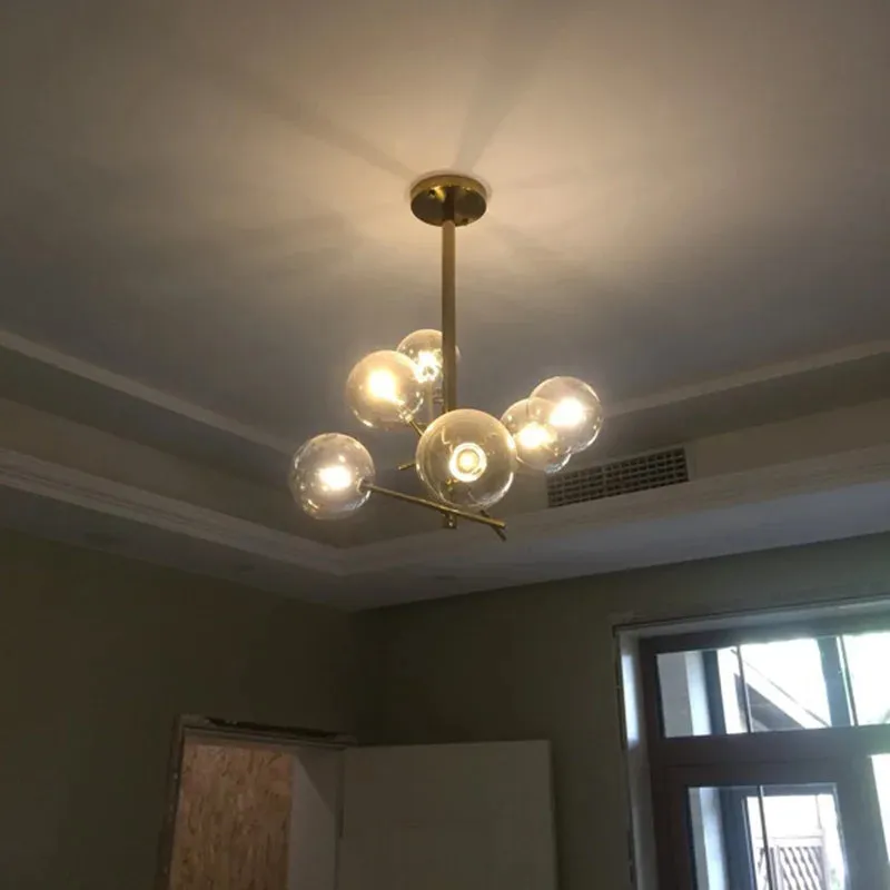 6 Light Sputnik Chandelier In Antique Brass Finish With Clear Glass Spheric Shades And Adjustable Arms