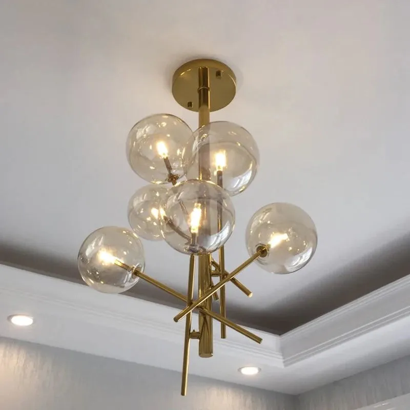 6 Light Sputnik Chandelier In Antique Brass Finish With Clear Glass Spheric Shades And Adjustable Arms