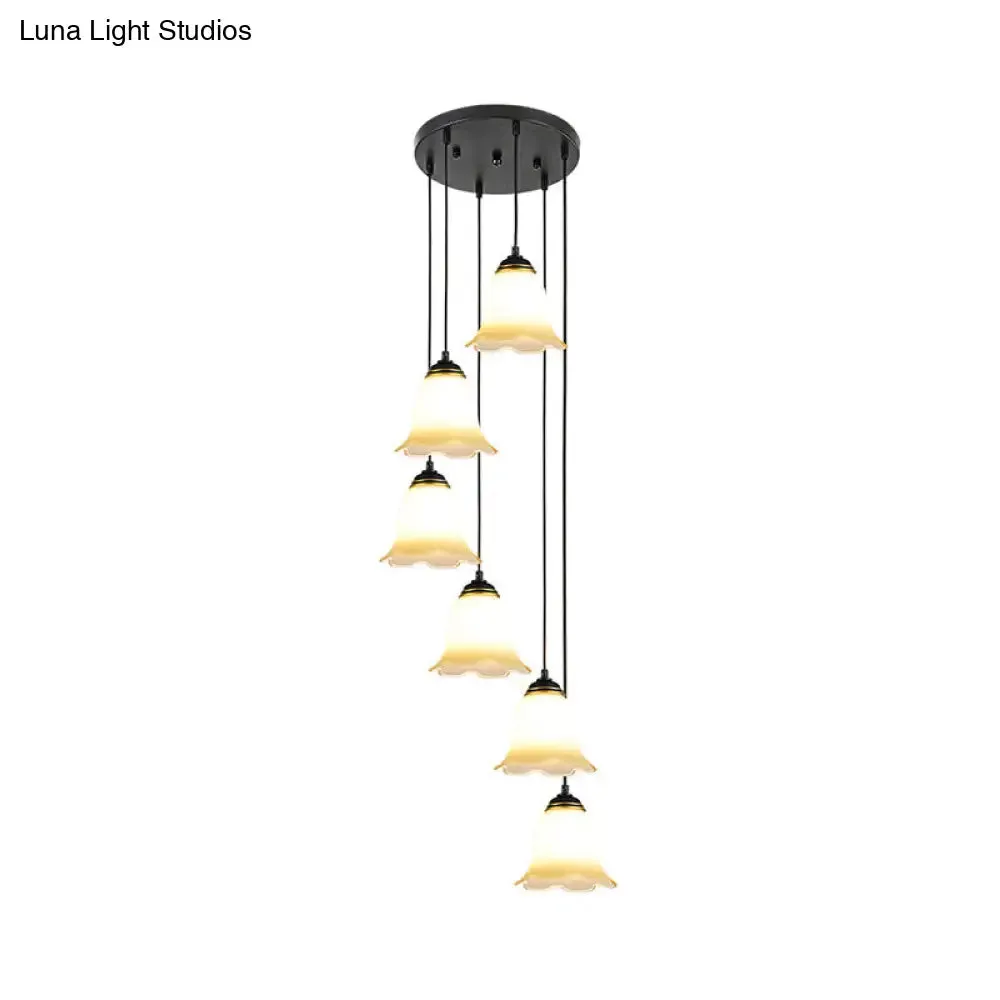 Minimalist Black Flower Stairs Pendant Light with Frosted Glass and Round Canopy
