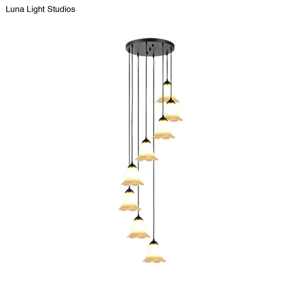 Minimalist Black Flower Stairs Pendant Light with Frosted Glass and Round Canopy