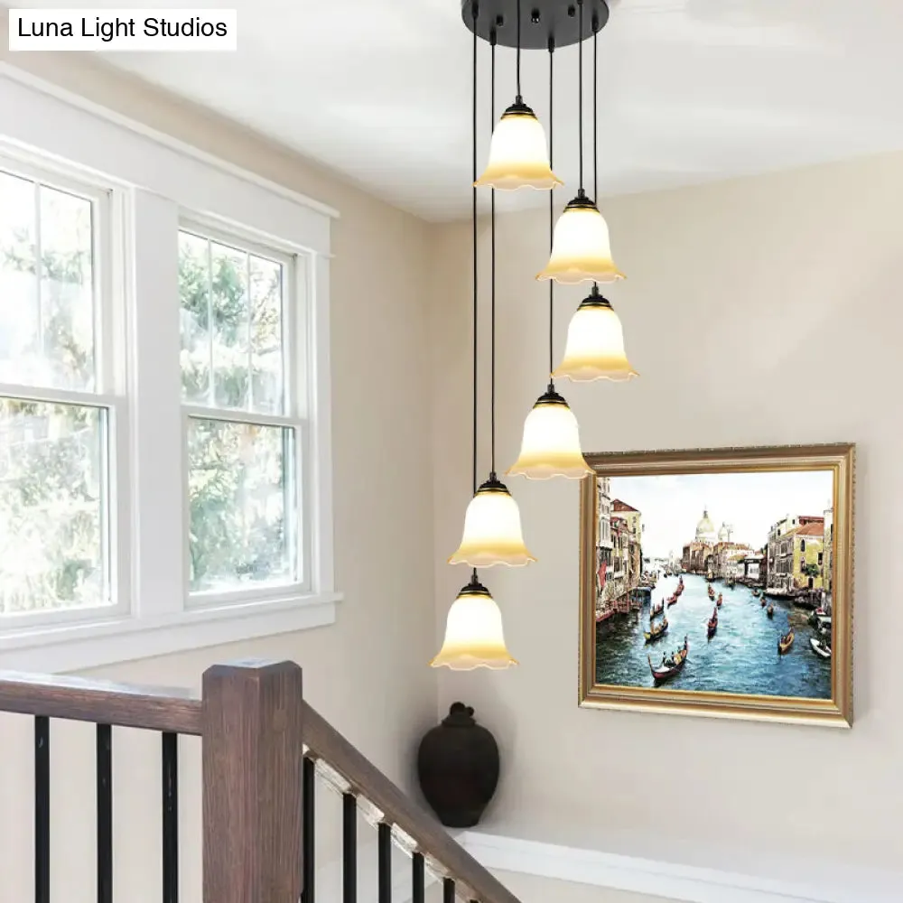 Minimalist Black Flower Stairs Pendant Light with Frosted Glass and Round Canopy