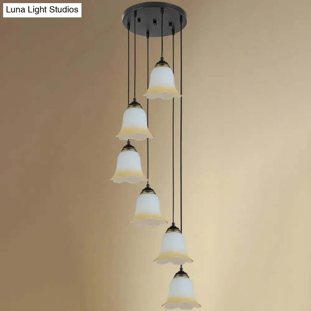 Minimalist Black Flower Stairs Pendant Light with Frosted Glass and Round Canopy