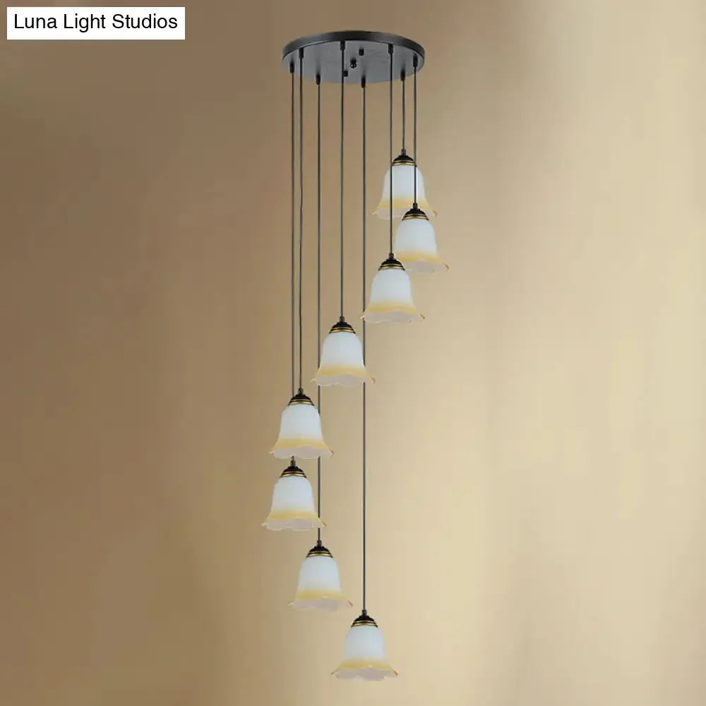 Minimalist Black Flower Stairs Pendant Light with Frosted Glass and Round Canopy