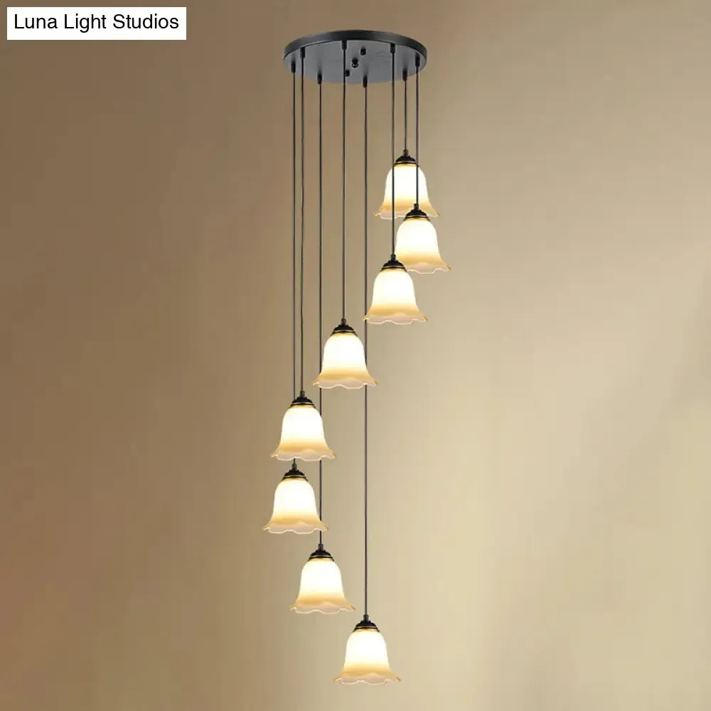Minimalist Black Flower Stairs Pendant Light with Frosted Glass and Round Canopy